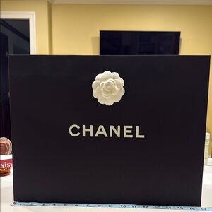 Chanel Elegant Black Bag with White Floral Detail